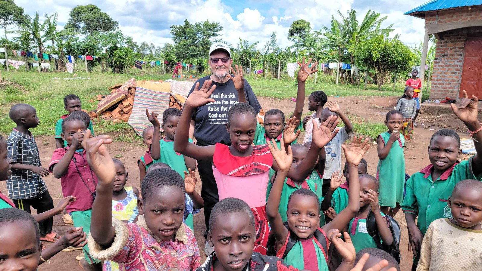 Apostle TJ Tipton with orphans in Uganda